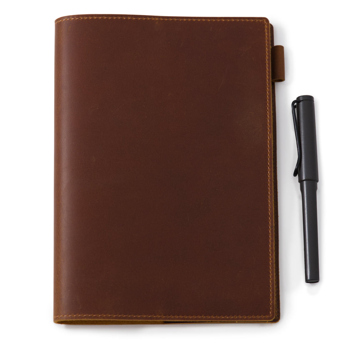 Brown leather notebook cover with a Lamy pen for scale. Pen sold separately