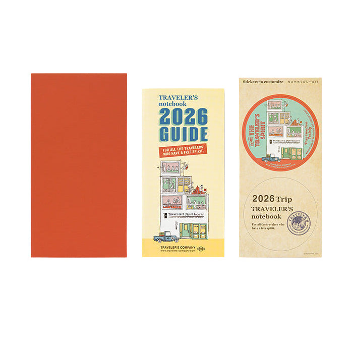 Orange coloured Traveler's Notebook Monthly Diary refill with a white label displaying '2026 Diary Monthly' on a white background