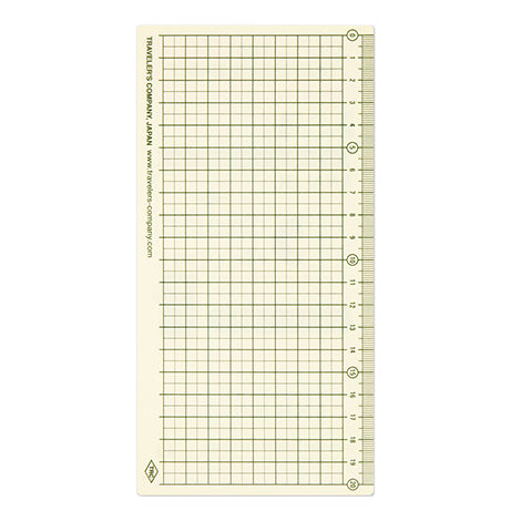 Side two  of the Traveler&#39;s Company backing card to fit Regular size notebooksshow the back side with a grid and ruler 