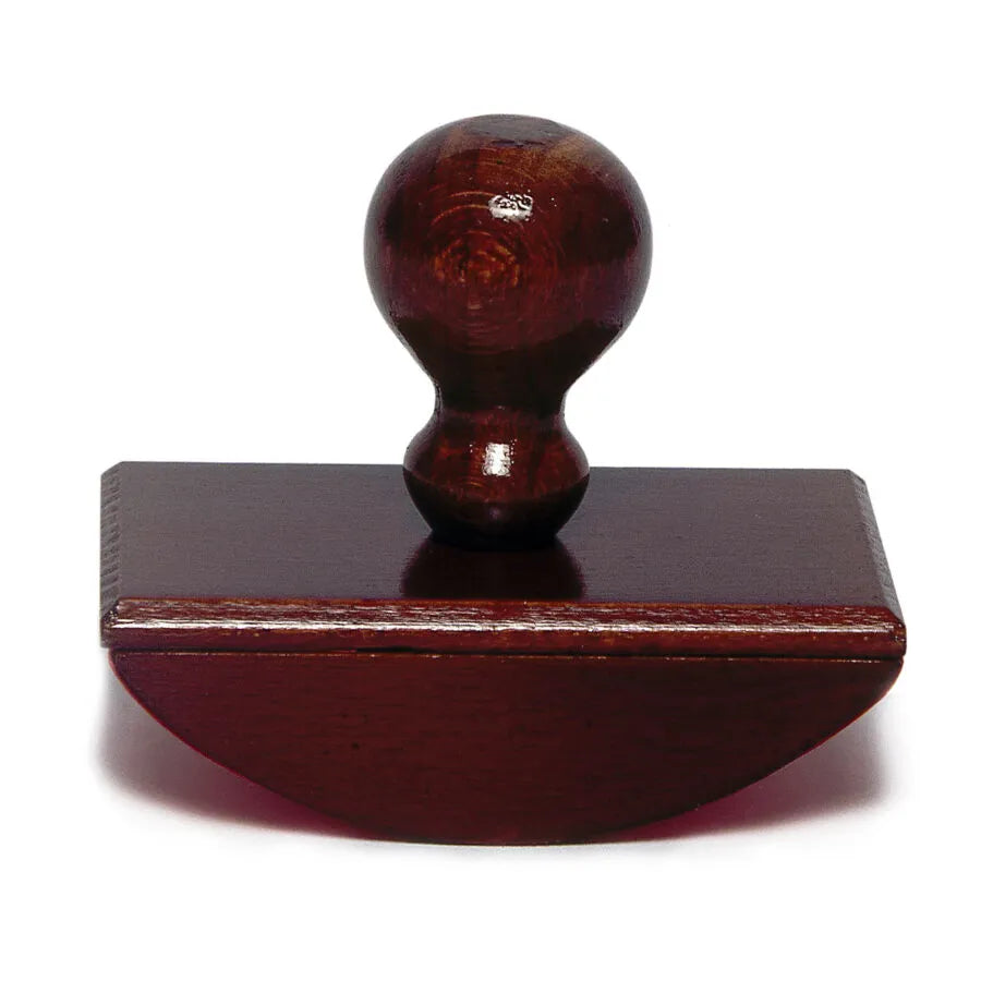 Wooden rocking blotter on a white background