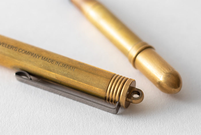 the aged appearance of the brass pen