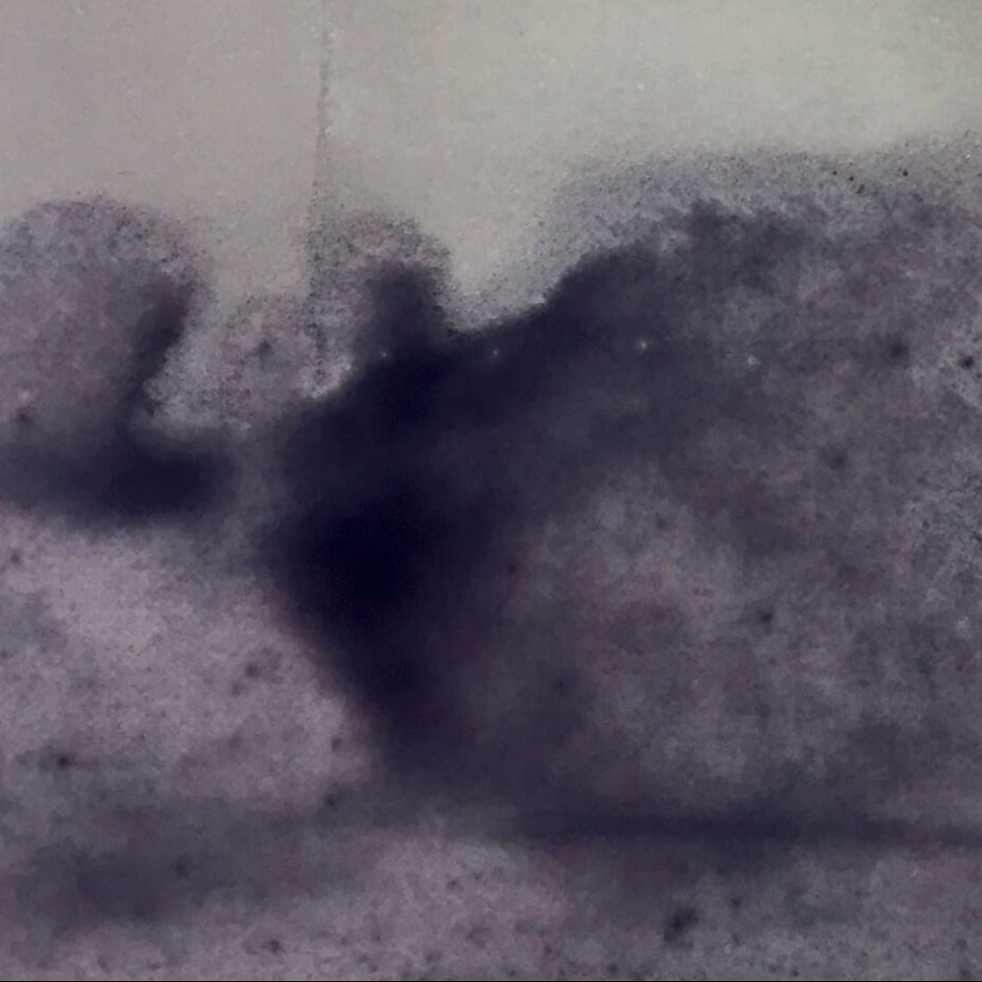 Shadow of a person on a textured surface