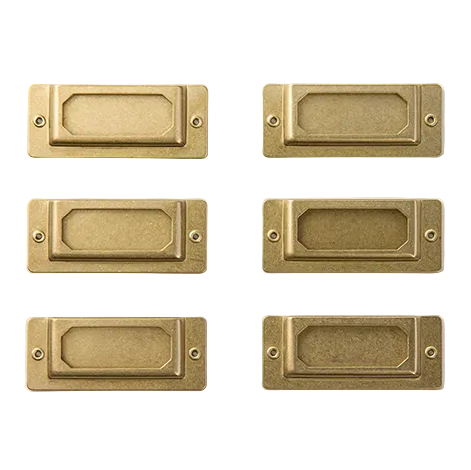 Set of six brass rectangular door handles on a white background