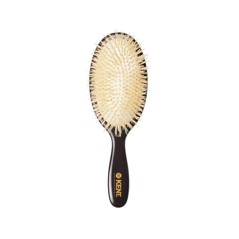 Kent hairbrush with black handle and beige bristles on a white background