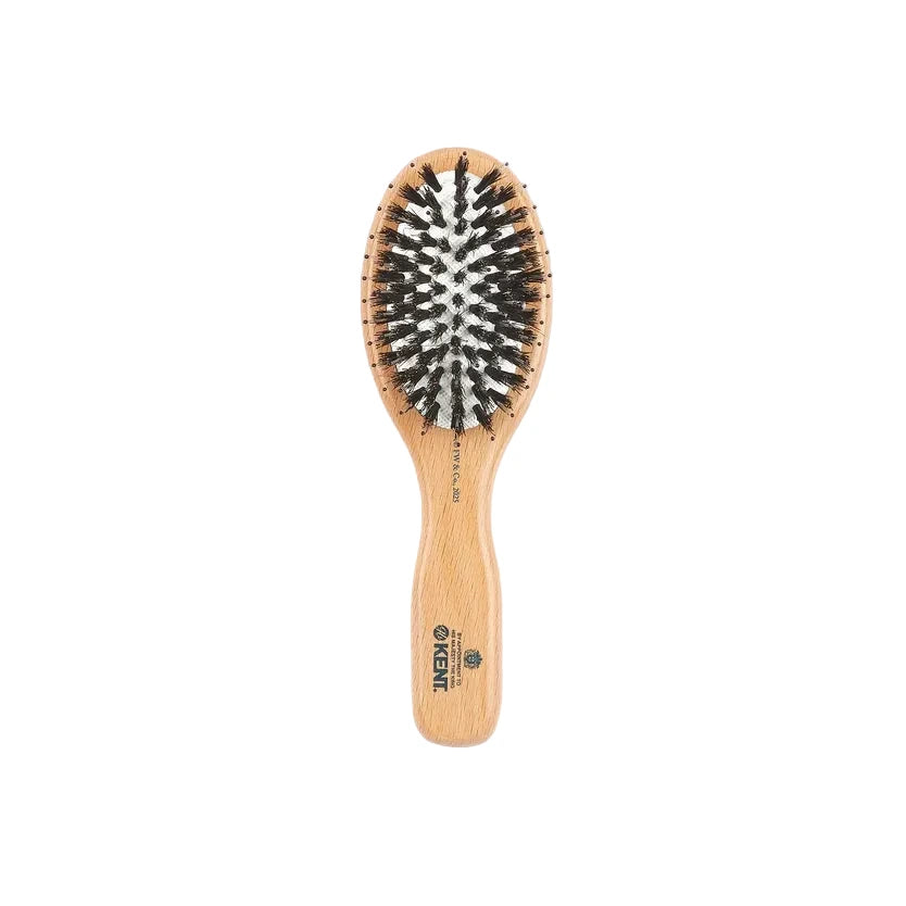 A wooden hairbrush with black and white bristles, featuring the brand name 'KIKIK' printed on the handle, set against a plain light gray background.