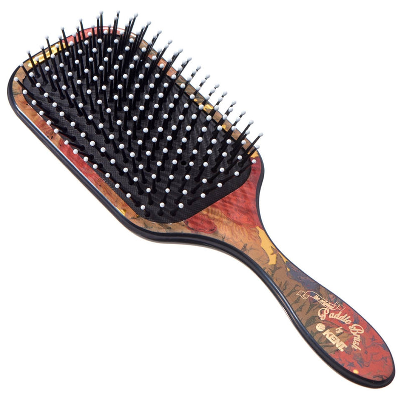 Hairbrush with a decorative handle on a white background