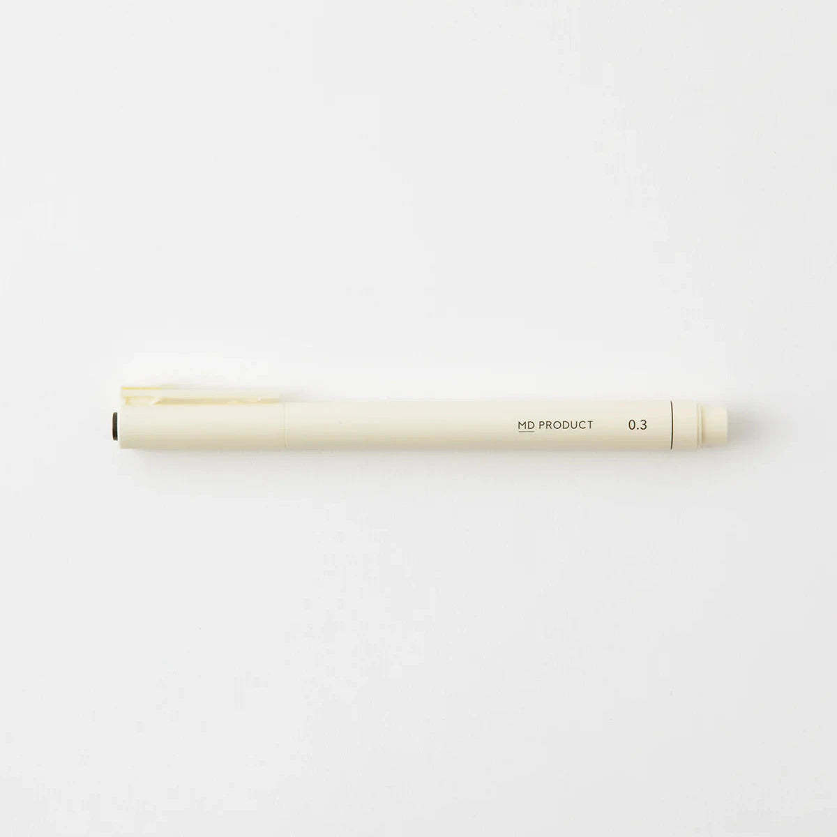 White pen with gold accents on a white background