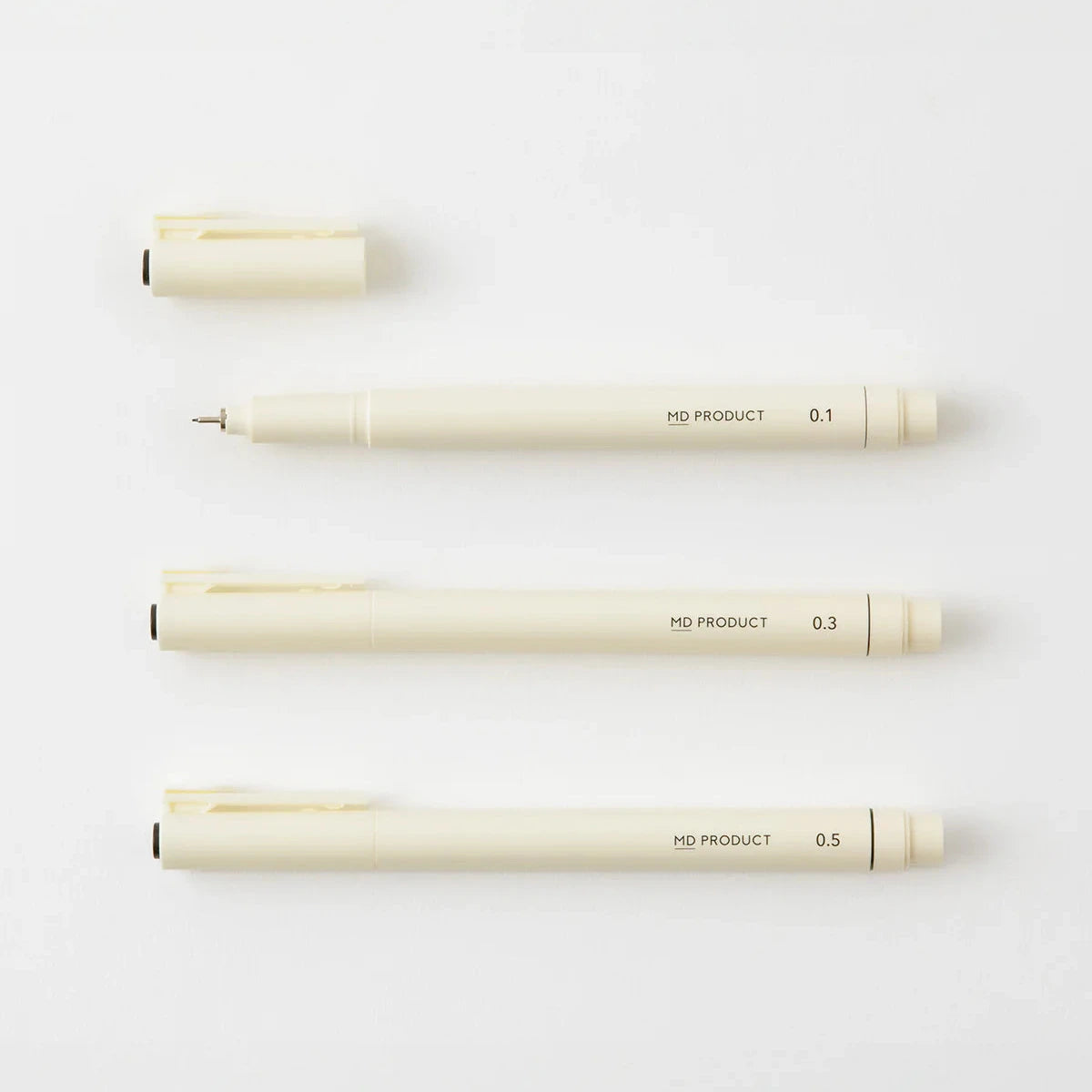 Set of four mechanical pencils with different lead sizes on a white background