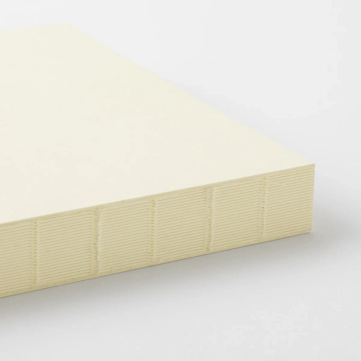 Beige mattress on a white background