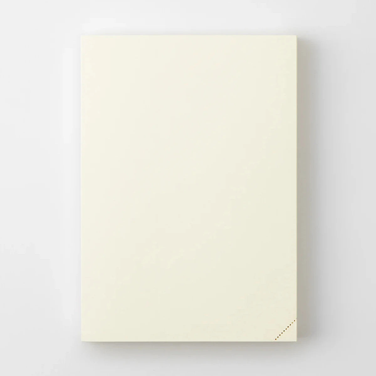 Beige notebook with minimalist design on a white background