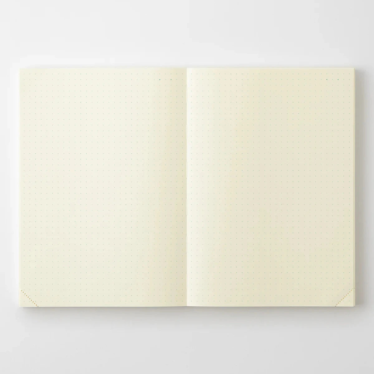 Open notebook with cream-colored pages on a white background