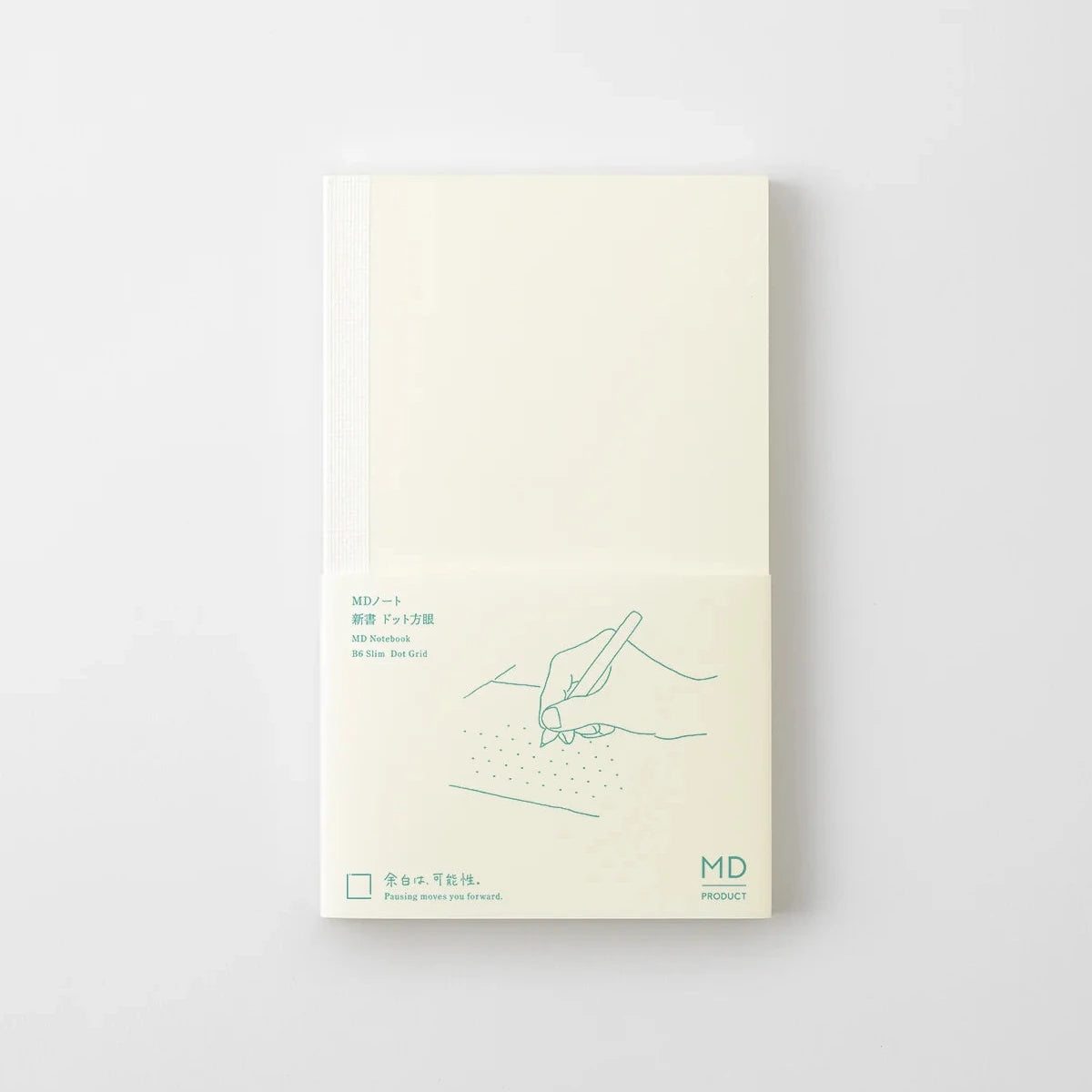 A cream-colored notebook with a white elastic band, featuring a minimalist green line drawing of hands writing and the text 'MD Product' on the cover, set against a light gray background.