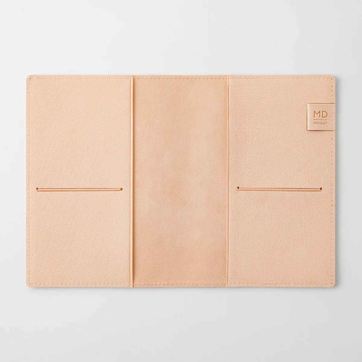 Beige leather wallet with two card slots on a light gray background