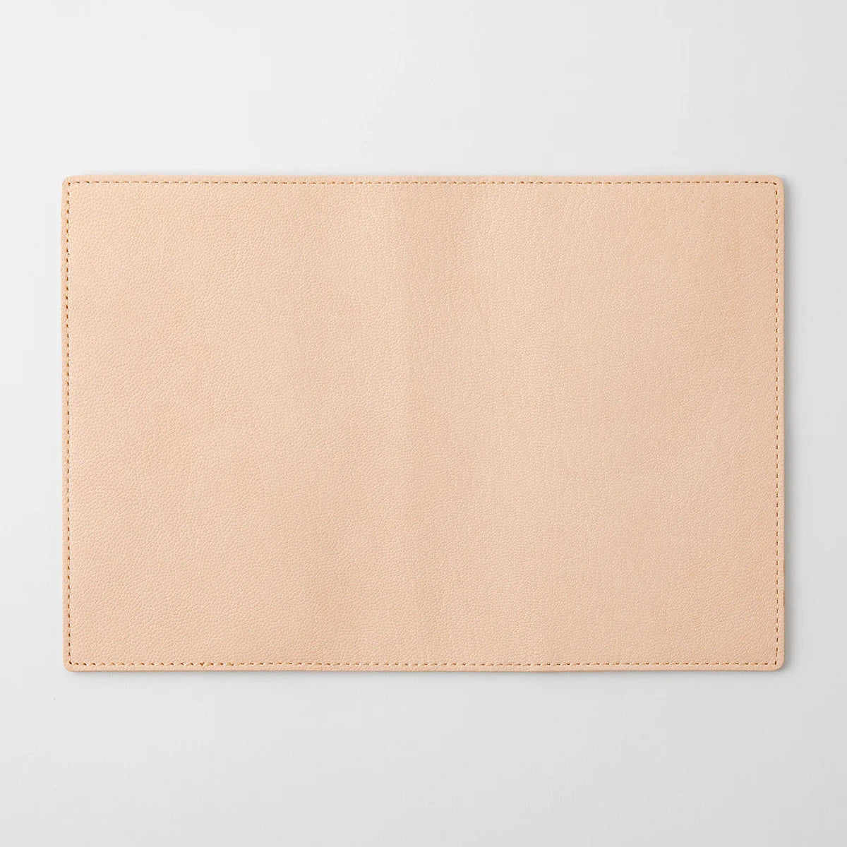 Beige leather pouch on a light gray background