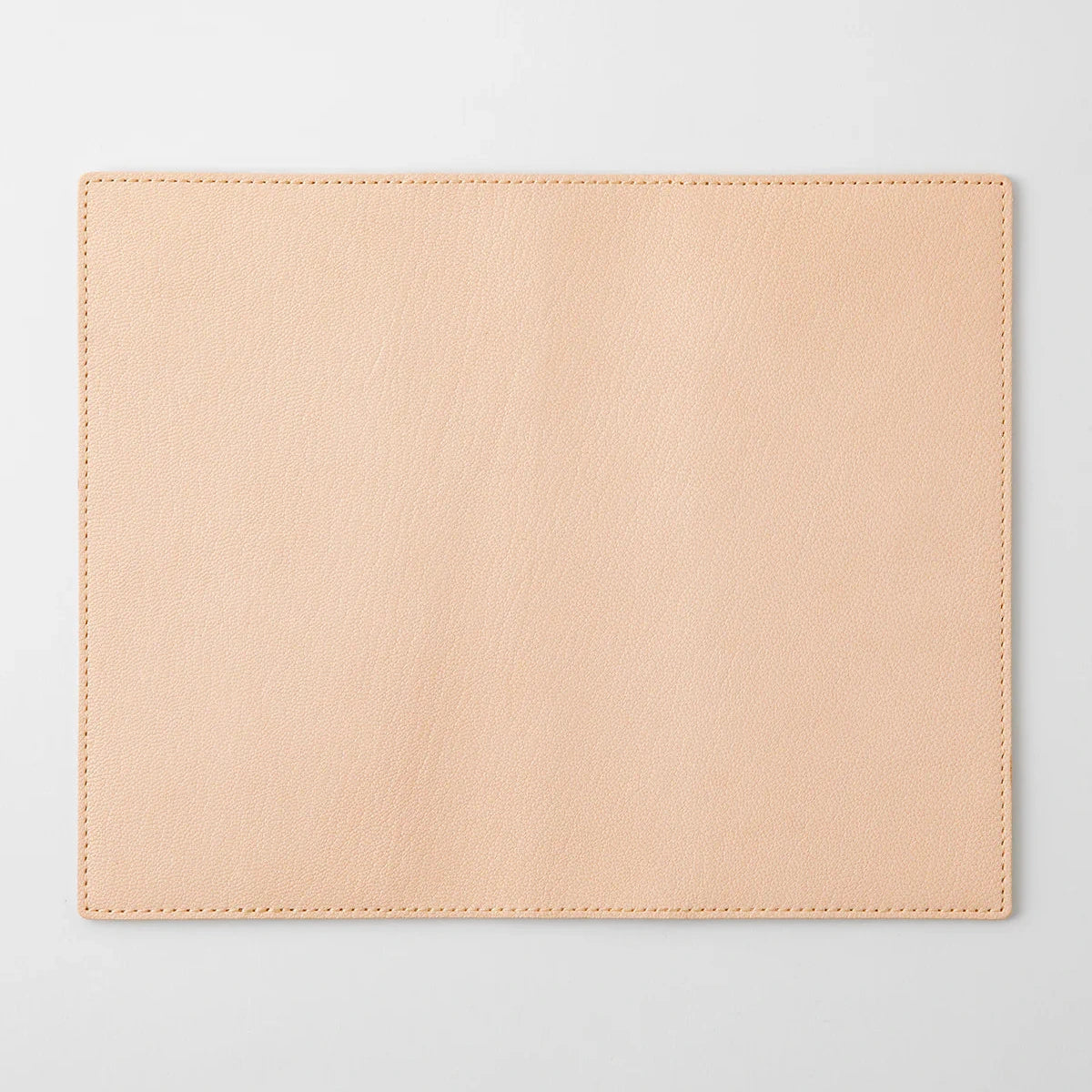 Beige placemat on a light gray background