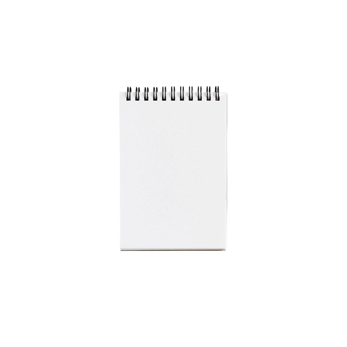 White spiral-bound notebook on a light gray background