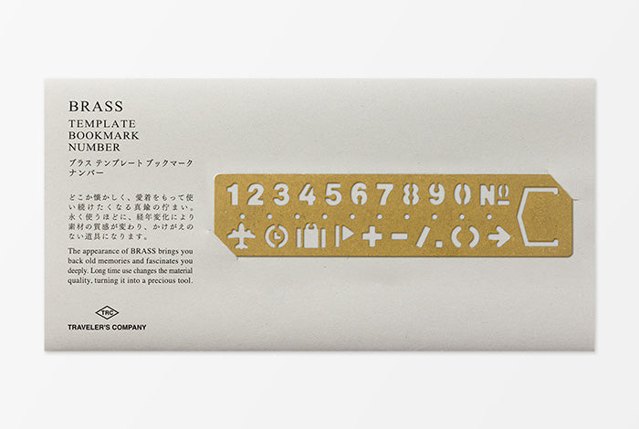 Brass template bookmark with numbers and symbols on a white background