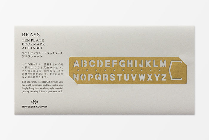 Brass template bookmark alphabet on a white box packaging