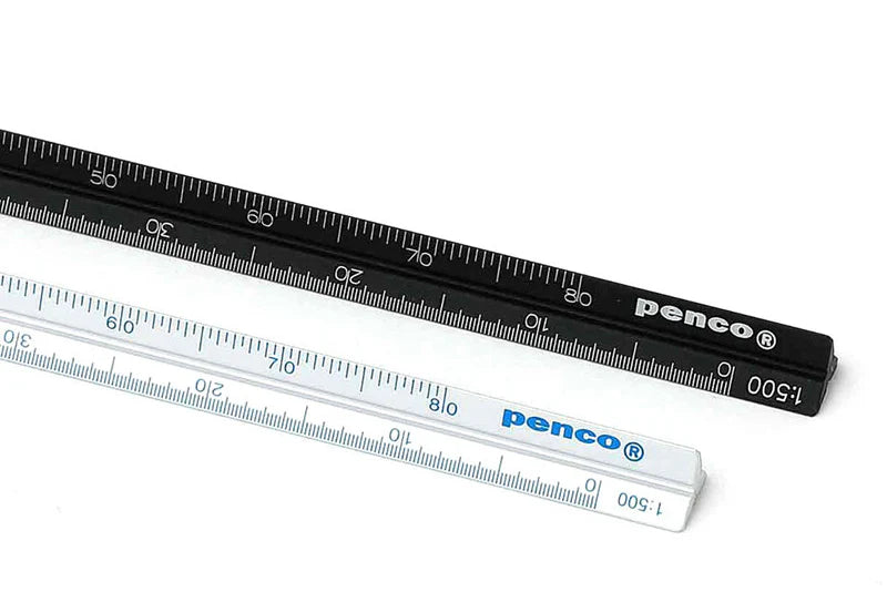 Close-up of two Penco triangular scale rules, one black and one white  on a white background.