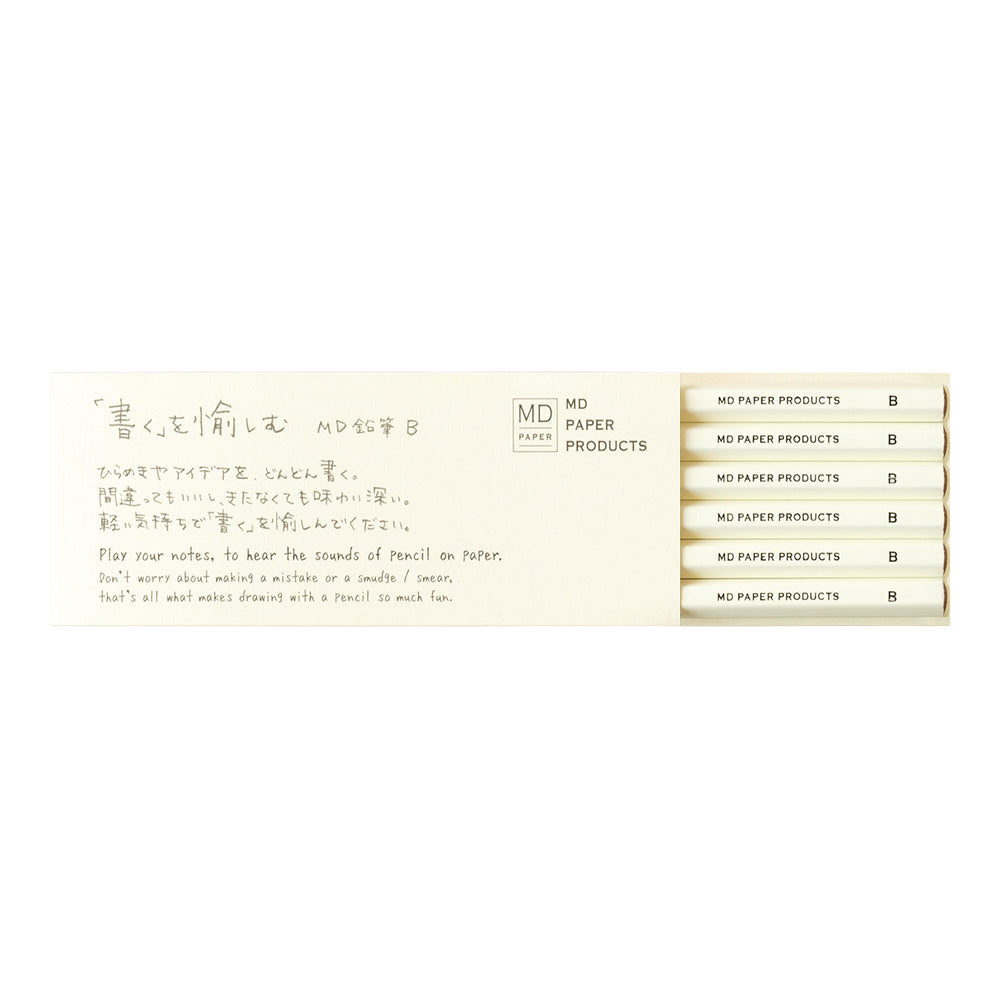 A pack of six MD Midori pencils with a beige color and text on the packaging that reads 'MD PAPER PRODUCTS' and 'NO.6 FLAT NOWHERE ELSE BUT HERE'.