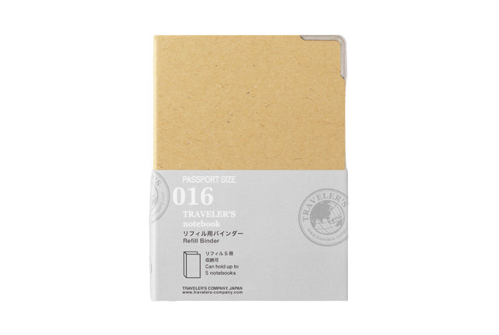 A kraft board Traveler's Notebook passport refill binder with the label '016 TRAVELER'S notebook' on the cover.