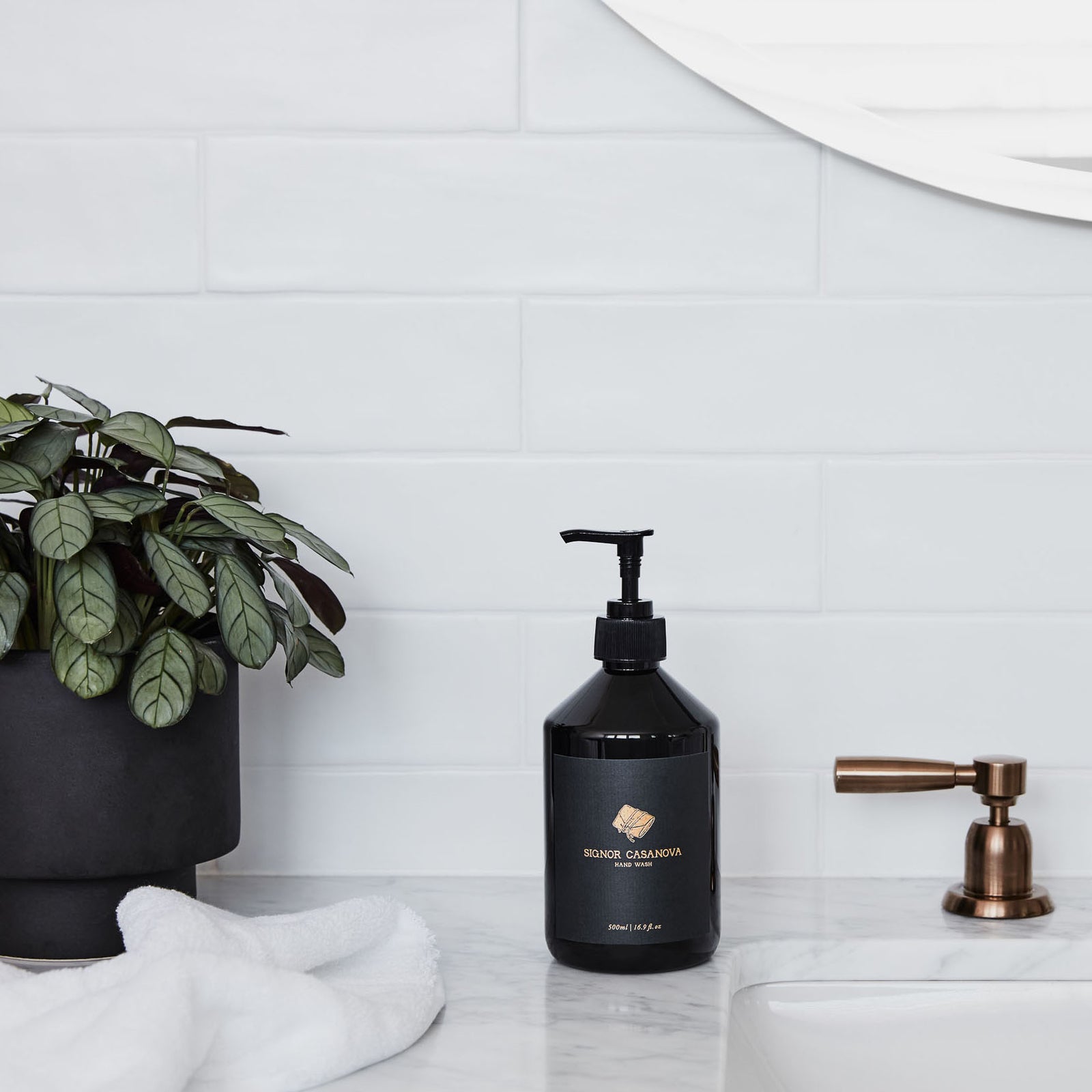 Black bottle of Signor Casanova hand wash on a white background