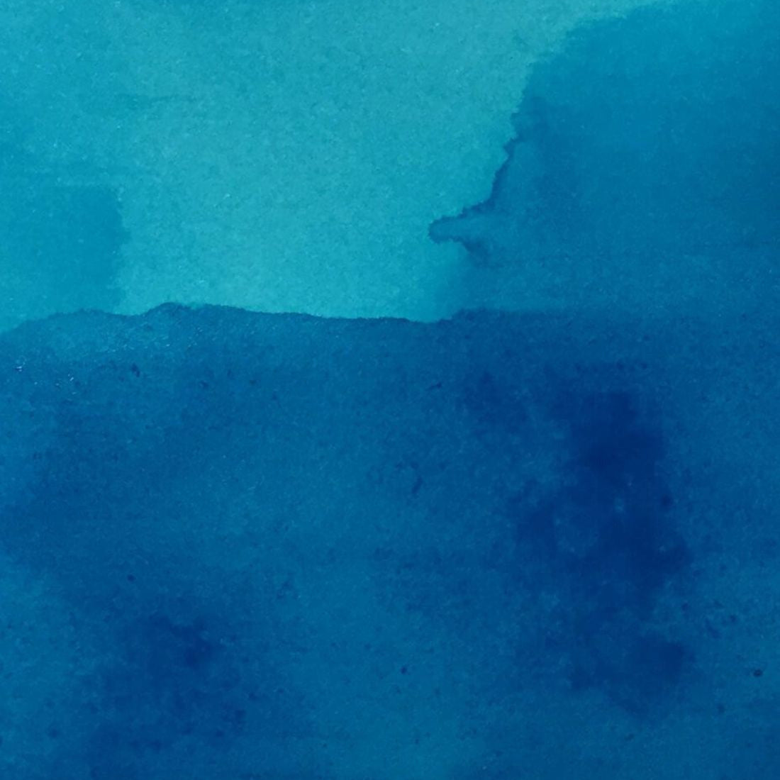 Close-up of textured blue watercolor paper