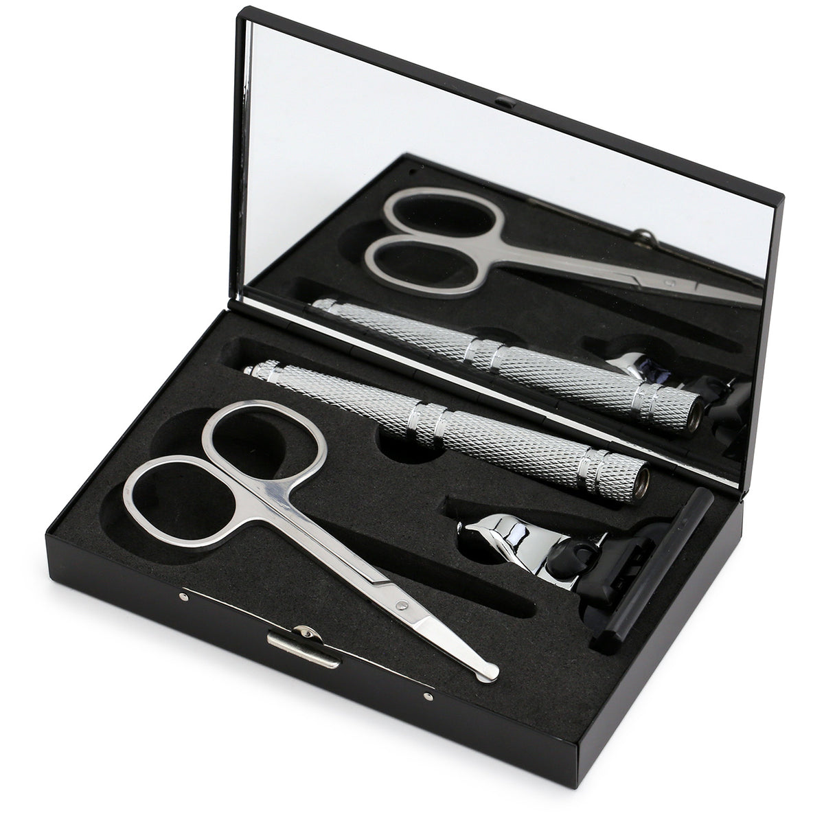 Izola travel set with cartridge razor, blunt-nosed scissors shown deconstructed on the open case with a mirror inside the lid