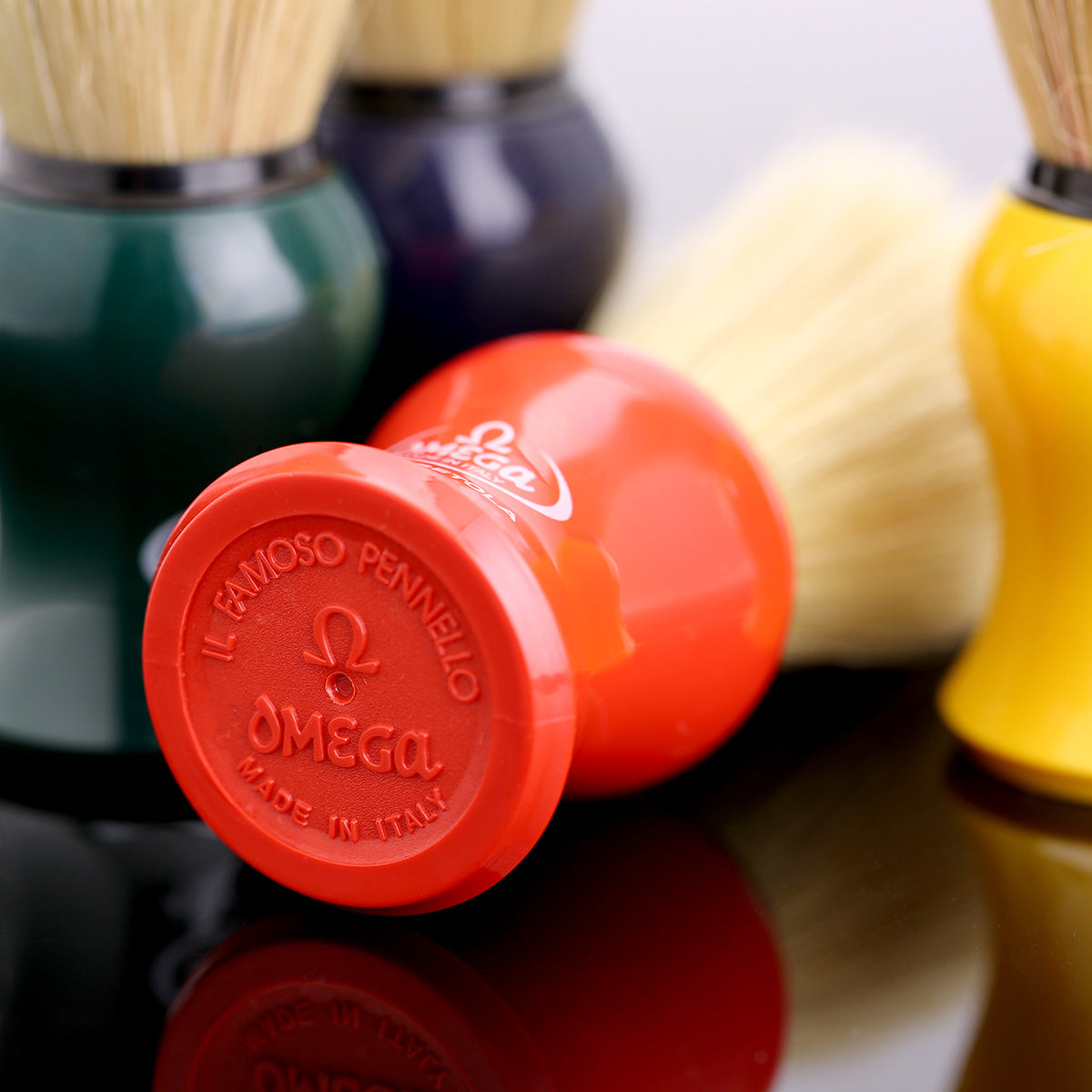 Omega Pure Bristle Shave Brush logo detail on base of the red brush