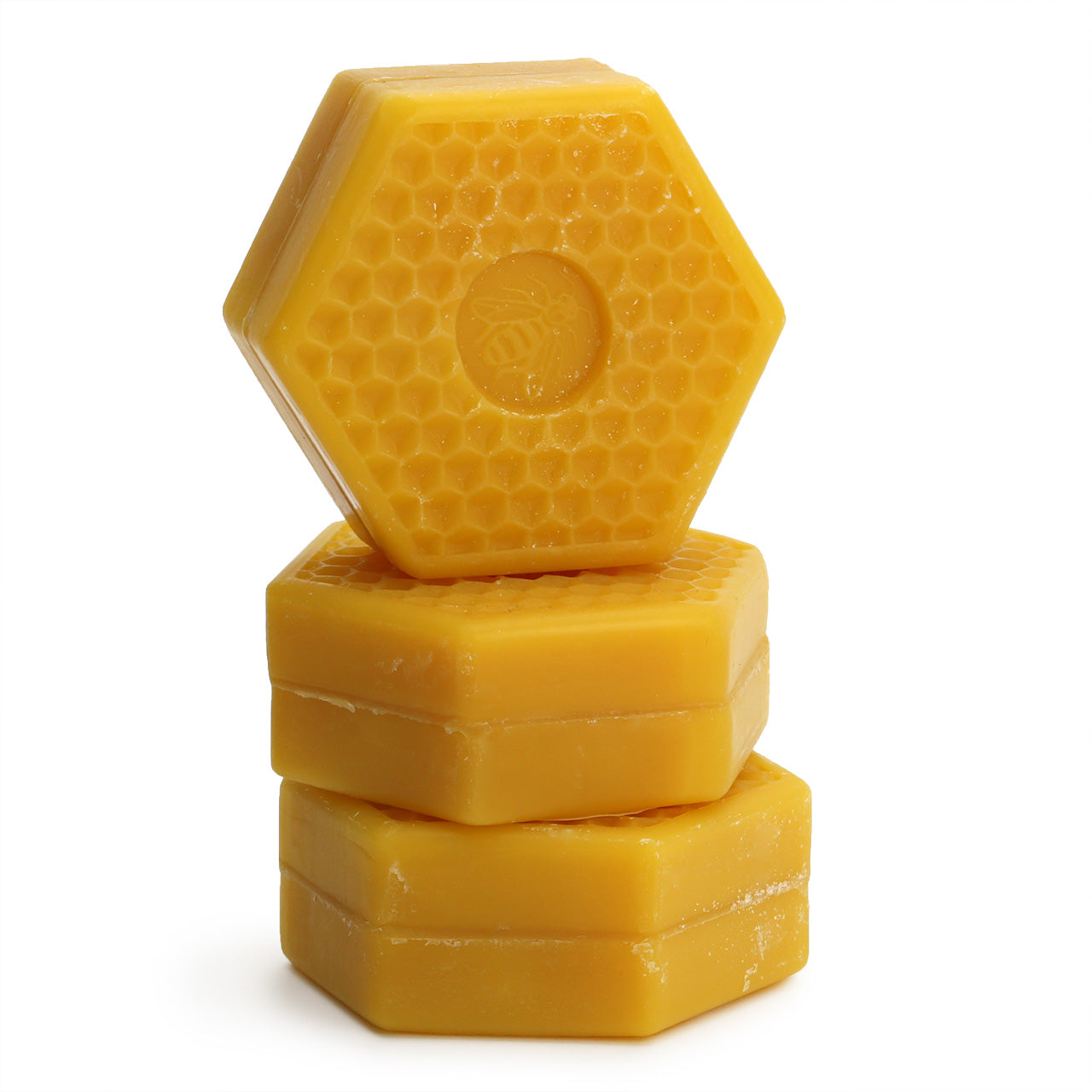 Speick Honey soap is a hexagonal puck with a stamp of a bee in the centre and a is golden honey colour 