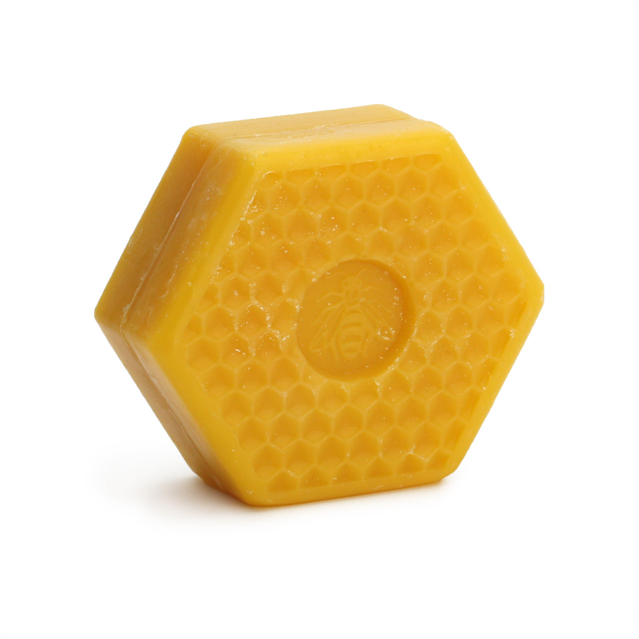 Speick Honey soap is a hexagonal puck with a stamp of a bee in the centre and a is golden honey colour 