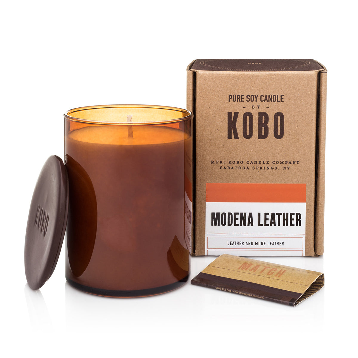 Kobo Large Pure Soy Candle in an amber glass jar with ceramic lid, matches and kraft box. Modena Leather scent