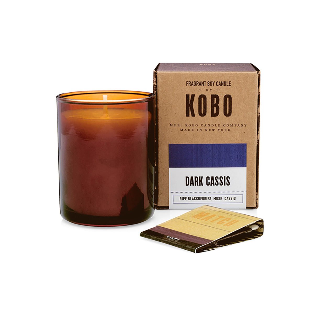 Kobo Pure Soy votive candle in an amber glass jar with ceramic matches and kraft box. Dark Cassis scent