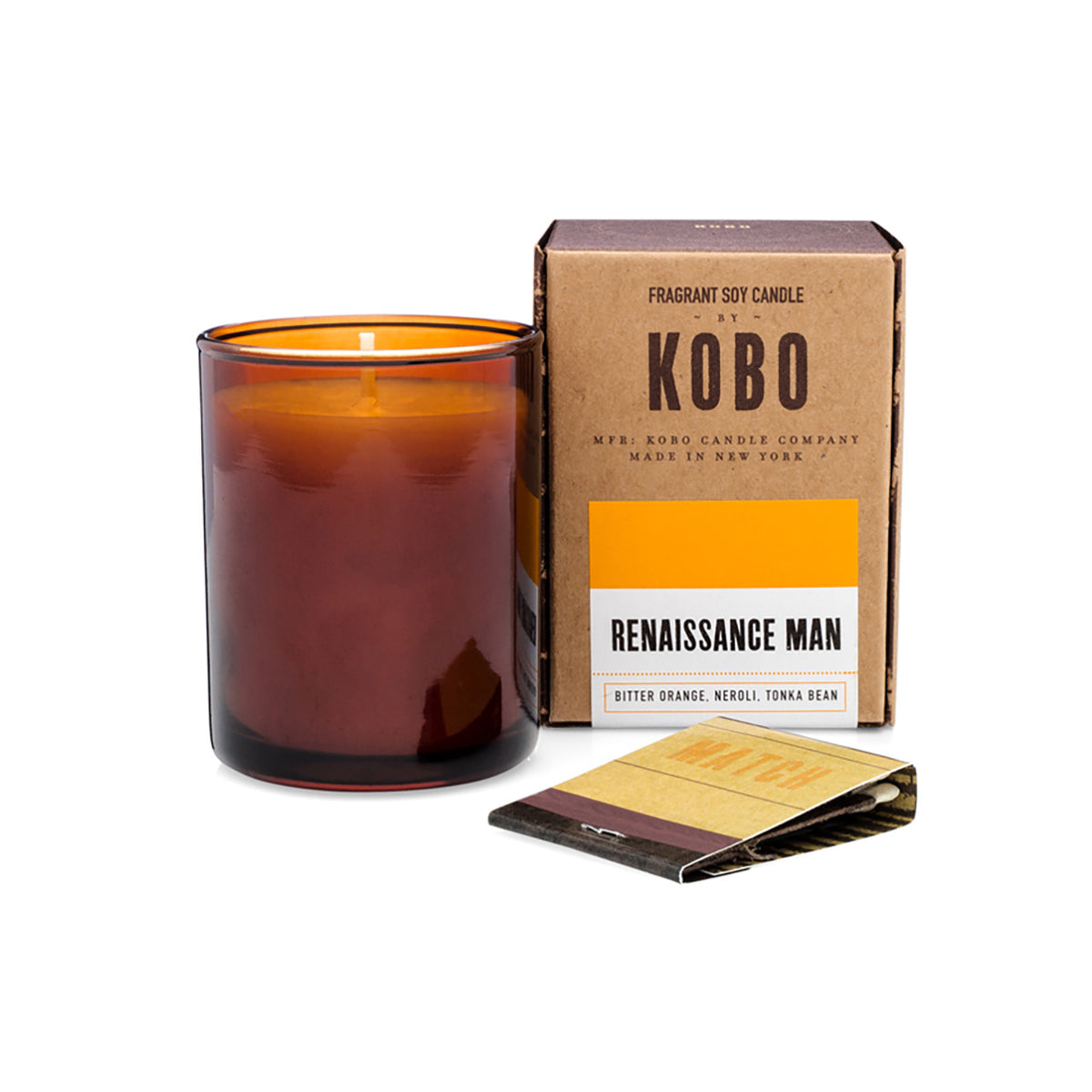 Kobo Pure Soy votive candle in an amber glass jar with ceramic matches and kraft box. Renaissance Man scent